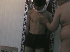 Young men in restraints give each other hand relief