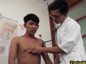 Asian doctor performs anal examination on young man